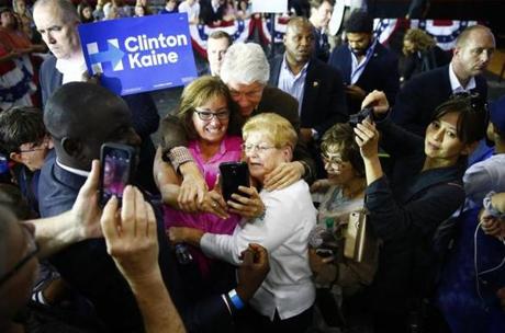 06BillClinton - Former President Bill Clinton takes photos with Hillary Clinton supporters after speaking at Harding Middle School in Steubenville, Ohio on Tuesday, October 4, 2016. (Jared Wickerham for The Boston Globe)
