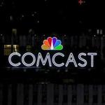 The NBC and Comcast logo are displayed on top of 30 Rockefeller Plaza in midtown Manhattan in New York July 1, 2015. REUTERS/Brendan McDermid/File Photo GLOBAL BUSINESS WEEK AHEAD PACKAGE - SEARCH 