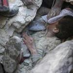 A young Syrian boy received oxygen as he was pulled from the rubble of a building after Russian airstrikes on the rebel-held Fardous neighbourhood of the northern Syrian city of Aleppo on Tuesday.