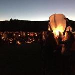 Students at Harwood Union High School in Duxbury, Vt. send lanterns into the air during a candle light vigil at the school Monday night to honor of their four classmates and a fifth friend who died Saturday night in a wrong-way crash on Interstate 89. 