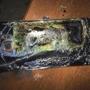 This Sunday, Oct. 9, 2016, photo shows a damaged Samsung Galaxy Note 7 on a table in Richmond, Va., after it caught fire earlier in the day. Samsung Electronics said Tuesday, Oct. 11, that it is discontinuing production of Galaxy Note 7 smartphones permanently, a day after stopping global sales of the ill-fated devices. (Shawn L. Minter via AP)