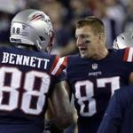 New England Patriots tight ends Martellus Bennett (88) and Rob Gronkowski (87) speak during the second half of an NFL football game against the Houston Texans Thursday, Sept. 22, 2016, in Foxborough, Mass. (AP Photo/Elise Amendola)
