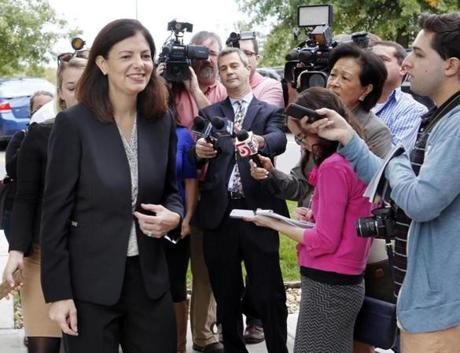Republican U.S. Sen. Kelly Ayotte walks away from reporters Tuesday Oct. 4, 2016 in Hudson, N.H., after telling them she â??misspokeâ?? when she said Donald Trump is a role model for children during a live televised debate the night before. (AP Photo/Jim Cole)
