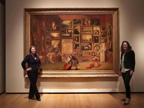 Sarah Kennel (left) and Austen Barron Bailly with the Samuel Morse painting ?A Gallery of the Louvre? at the Peabody Essex Museum.
