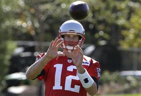 New England Patriots quarterback Tom Brady catches the ball during an NFL football practice Wednesday, Oct. 12, 2016, in Foxborough, Mass. (AP Photo/Steven Senne)
