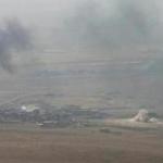 Smoke rose from clashes Monday near Mosul, Iraq.