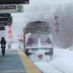 WOBURN, MA - Feb 11, 2015,- Again snow falls as commuter waits at Anderson Regional Transportation center in Woburn for commuter rail early Wednesday morning as train service is restored after closing yesterday due to snow problems. (globe staff photo :Joanne Rathe section: reporter: topic: 12 commuters )