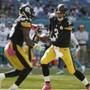 Pittsburgh Steelers quarterback Landry Jones (3) hands the ball to Pittsburgh Steelers running back Le'Veon Bell (26), during the first half of an NFL football game against the Miami Dolphins, Sunday, Oct. 16, 2016, in Miami Gardens, Fla. (AP Photo/Lynne Sladky)