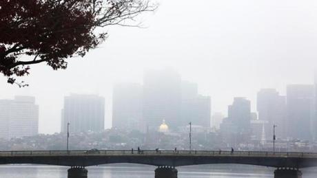 The Boston skyline, as viewed from Cambridge, was enshrouded in fog on Tuesday. 
