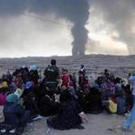 Iraqis fled their homes near Mosul Tuesday as Kurdish and government forces advanced toward Islamic State positions.
