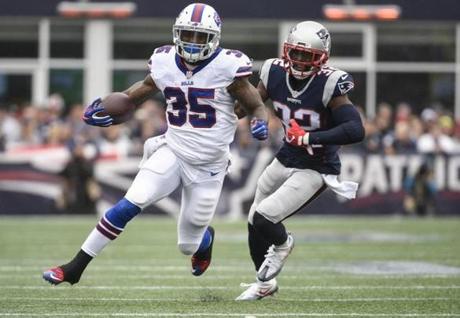 FOXBORO, MA - OCTOBER 2: Mike Gillislee #35 of the Buffalo Bills carries the ball past Devin McCourty #32 of the New England Patriots in the first quarter at Gillette Stadium on October 2, 2016 in Foxboro, Massachusetts. (Photo by Kevin Sabitus/Getty Images)
