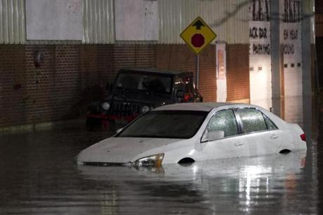 Cars are left stranded in flood waters on Washington Street in Worcester, Massachusetts on October 21, 2016. Flash flooding in the area left many motorists stranded and closed down parts of route I-290. Matthew Healey for The Boston Globe (FREELANCE SUBMISSION)
