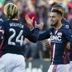 Oct 23, 2016; Foxborough, MA, USA; New England Revolution forward Diego Fagundez (14) is congratulated by midfielder Lee Nguyen (24) after he scored against the Montreal Impact during the first half at Gillette Stadium. Mandatory Credit: Winslow Townson-USA TODAY Sports
