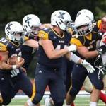 Westwood, MA 09/10/16 Everett and Xaverian high school football.....................(George Rizer for the Globe) for SPORTS XAVERIAN BACK #33 DEVON PICCININ BREAKS TWO ARM TACKLES AND FOLLOWS BLOCKING UP FRONT... 