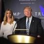 Republican presidential nominee Donald Trump speaks as his daughter Ivanka looks on during the grand opening of the Trump International Hotel in Washington, DC on October 26, 2016. / AFP PHOTO / Mandel NGANMANDEL NGAN/AFP/Getty Images