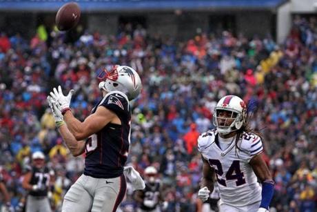 Orchard Park, NY - 10/30/2016 - (1st quarter) New England Patriots wide receiver Chris Hogan (15) beats Buffalo Bills cornerback Stephon Gilmore (24) as he makes the reception of a long pass by New England Patriots quarterback Tom Brady (12), not pictured, for a touchdown during the first quarter. The Buffalo Bills host the New England Patriots at New Era Field in Orchard Park, NY. - (Barry Chin/Globe Staff), Section: Sports, Reporter: Ben Volin, Topic: 31Patriots-Bills, LOID: 8.3.470379750.
