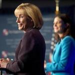 A campaign spokeswoman for incumbent Republican Senator Kelly Ayotte (right) had called on Governor Maggie Hassan earlier Sunday to return the donations.
