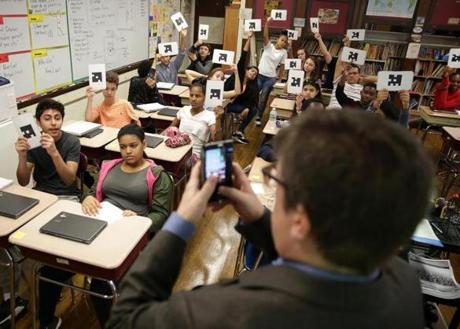 West Roxbury Ma 10-19-2016 Teacher Christian Scott (cq) uses QR Code Technology in his Civics in Action class, for 8th graders at the Patrick Lyndon Elementary School. The students are looking at this years Presidential Election as a topic of study. Boston Globe Staff/Photographer Jonathan Wiggs 
