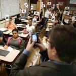 West Roxbury Ma 10-19-2016 Teacher Christian Scott (cq) uses QR Code Technology in his Civics in Action class, for 8th graders at the Patrick Lyndon Elementary School. The students are looking at this years Presidential Election as a topic of study. Boston Globe Staff/Photographer Jonathan Wiggs 