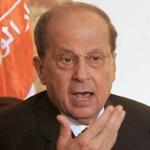 Supporters of president-elect Michel Aoun Monday held his photo and flags of his Free Patriotic Movement. 