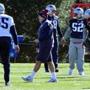Patriots coach Bill Belichick and Linebacker Elandon Roberts, center, (#52) at warm up before practice the day after departure of Jamie Collins #91. Josh Reynolds for The Boston Globe (Sports, Scarnecchia)
