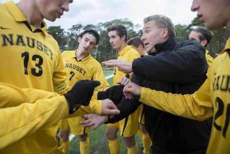 Nauset varsity soccer head coach, John McCully, with his players moments before their home again against New Bedford on Oct. 25.
