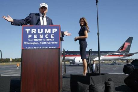 Melania Trump (right) walked offstage as Donald Trump spoke Saturday during a campaign rally in Wilmington, N.C.
