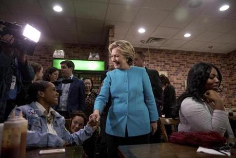 Democratic presidential candidate Hillary Clinton greets patrons at Cedar Park Cafe in Philadelphia, Sunday, Nov. 6, 2016. (AP Photo/Andrew Harnik)
