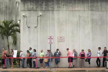 Early voters lined up outside the West Dade Regional Library in Miami on Monday.
