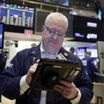  A trader worked on the floor of the New York Stock Exchange on Monday. Asian markets moved higher Tuesday as US voters prepared to weigh in on the presidential election.