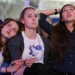 Wellesley, MA - November 08, 2016: (left to right) Wellesley College first year students Emma Conrad-Rooney, Allie Collins-Anderson and Vienna Thomas watch late results during an Election Night watch party at the Dorothy Town Field House at Wellesley College in Wellesley on November 08, 2016. Students, alums, and women of all ages gathe. (Craig F. Walker/The Boston Globe) Section: Metro reporter: