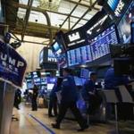 A campaign poster of Donald Trump is displayed on the floor of the New York Stock Exchange. 