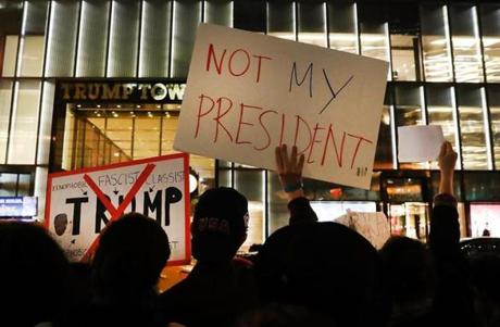 NEW YORK, NY - NOVEMBER 10: Dozens of anti-Donald Trump protesters stand along 5th Avenue in front of Trump Tower as New Yorkers react for a second night to the election of Trump as president of the United States on November 10, 2016 in New York City. Trump defeated Democrat Hillary Clinton to become the 45th president. (Photo by Spencer Platt/Getty Images) *** BESTPIX ***

