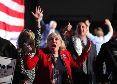 Braintree-11/08/2016- Trump supporter Virginia Greiman cheers as Wisconsin goes to Trump as she watched the election results on a giant tv at an election night party for Donald Trump held at the F1 indoor car racetrack ballroom. John Tlumacki/Globe Staff (metro)

