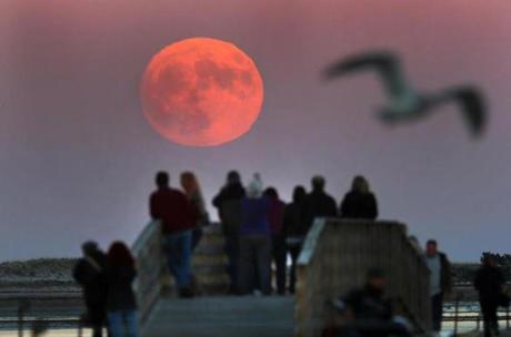 A supermoon rose at 4:14 p.m. over Plymouth Harbor on Sunday.
