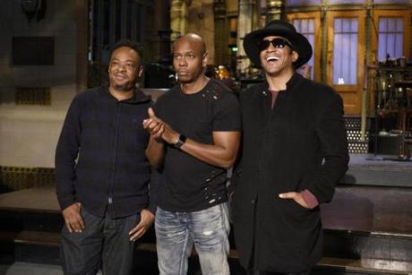 Jarobi White and Q-Tip of A Tribe Called Quest flank host Dave Chappelle on the set of ?Saturday Night Live.?
