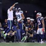 Part of the reason Doug Baldwin (89) caught three touchdown passes is because Patriots defensive backs were left in coverage too long, a result of New England?s poor pass rush.