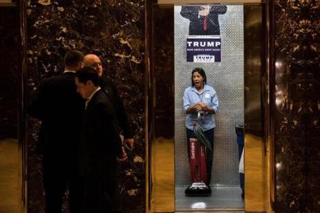 A maintenance worker yawns in an elevator in the lobby at Trump Tower in New York on Nov. 14.

