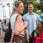 08/16/2014 EAST BOSTON, MA State Representative Carlo Basile (cq) greeted Alessandra Petruccelli (cq) (left) and her daughter Alexa (cq) 8, at Eastie Pride Day in Piers Park (cq). (Aram Boghosian for Boston.com)