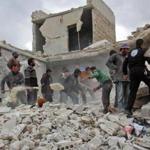 Rescuers and civilians inspect a destroyed building in the Syrian village of Kfar Jales, on the outskirts of Idlib, following air strikes by Syrian and Russian warplanes on November 16, 2016. Syrian and Russian warplanes bombed rebel-held areas in Aleppo and Idlib province overnight, a monitor said, a day after Moscow announced a fresh offensive against opponents of its Damascus ally. / AFP PHOTO / Omar haj kadourOMAR HAJ KADOUR/AFP/Getty Images