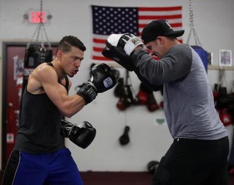 Dorchester.Ma-November 9, 2016-Stan Grossfeld/Globe Staff--- Boxer Gabriel Duluc works out at Grealish Boxing with assistant trainer Gerry Grealish.
