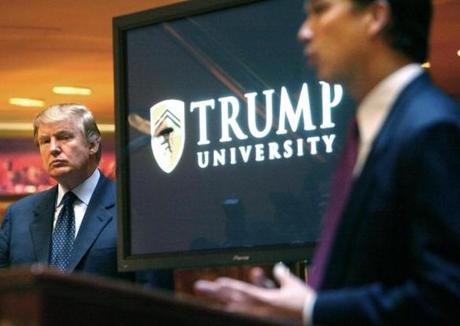 In this May 23, 2005 file photo, Donald Trump, left, listened as Michael Sexton introduced him at a news conference in New York where he announced the establishment of Trump University.
