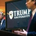 In this May 23, 2005 file photo, Donald Trump, left, listened as Michael Sexton introduced him at a news conference in New York where he announced the establishment of Trump University.