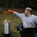 For Globe reporter Nestor Ramos, deep-frying a 14-pound turkey in his backyard takes a little patience, a little precaution ? and a little bourbon.