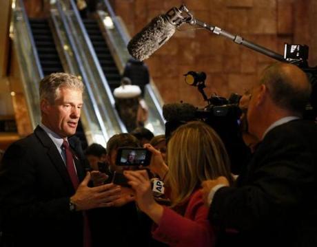 epa05641386 Former Senator of Massachusetts Scott Brown speaks to journalists after meeting with US President-elect Donald Trump, at the Trump Tower in New York, New York, USA, 21 November 2016. EPA/Aude Guerrucci / POOL

