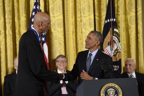 President Barack Obama shook hands with NBA star Kareem Abdul-Jabbar shortly before presenting him with the Presidential Medal of Freedom.
