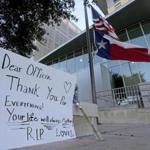An American flag and a Texas state flag flew at half-staff Monday at San Antonio police headquarters.