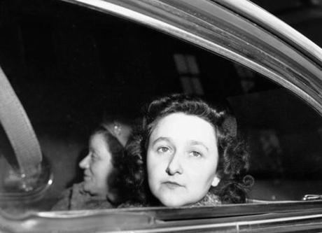 Ethel Rosenberg, wife of Julius Rosenberg, sits in car as she starts her trip to Sing Sing prison, April 11, 1951. U.S. Deputy Marshal Sarah Goldstein is with her. (AP Photo/Anthony Camerano)

