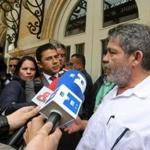 FARC leader Luis Alberto Alban spoke to media members outside the Teatro Colon in Bogota, Colombia, on Wednesday. 
