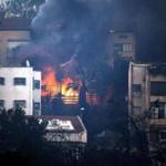 Smoke billowed from a house as a fire raged in the northern Israeli port city of Haifa on Thursday. 